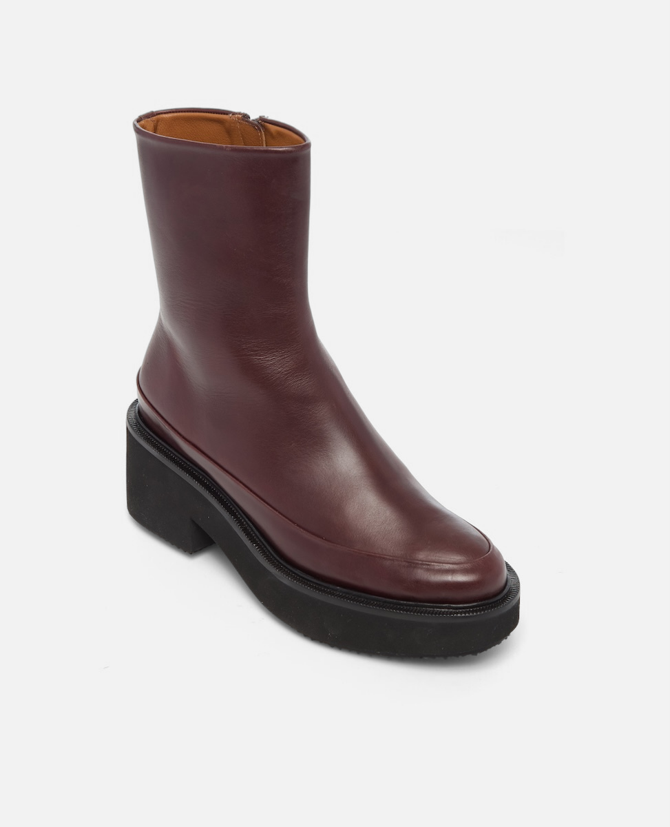 Brown leather boot on a white background