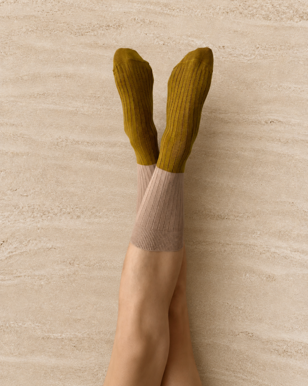 Escuyer Green knee-high socks with a beige gradient on a light background
