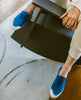 The Klara Sneaker in Blu Reale on a model with her legs over the side of a chair. 6