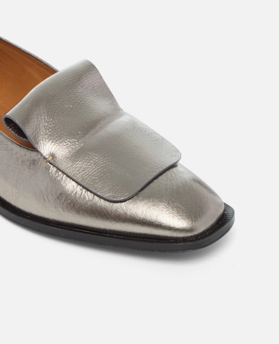 Silver loafer shoe on a white background