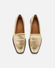 Pair of gold loafers on a white background 1