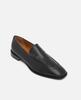 Black loafer shoe on a light gray background 3