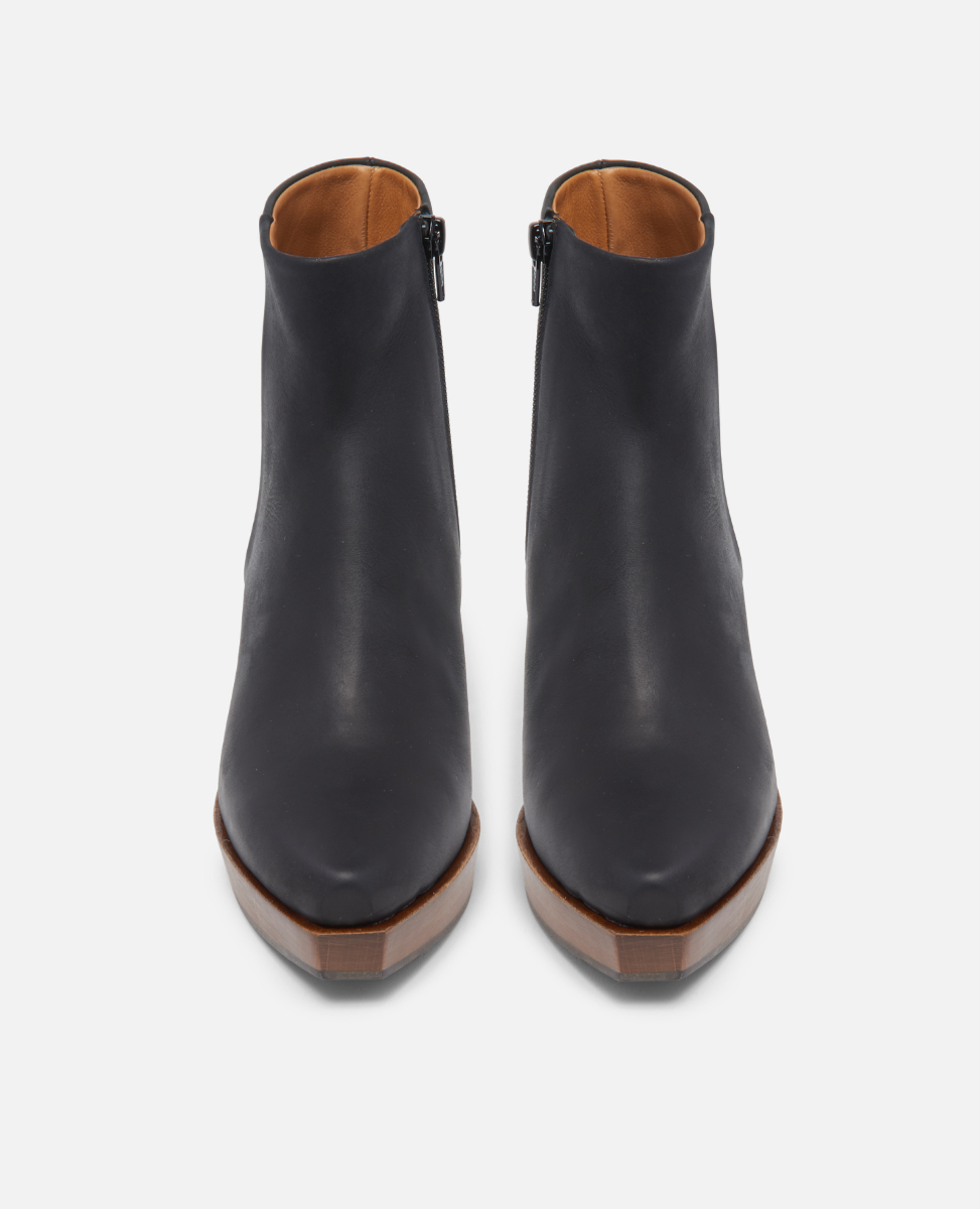 Pair of black ankle boots on a white background