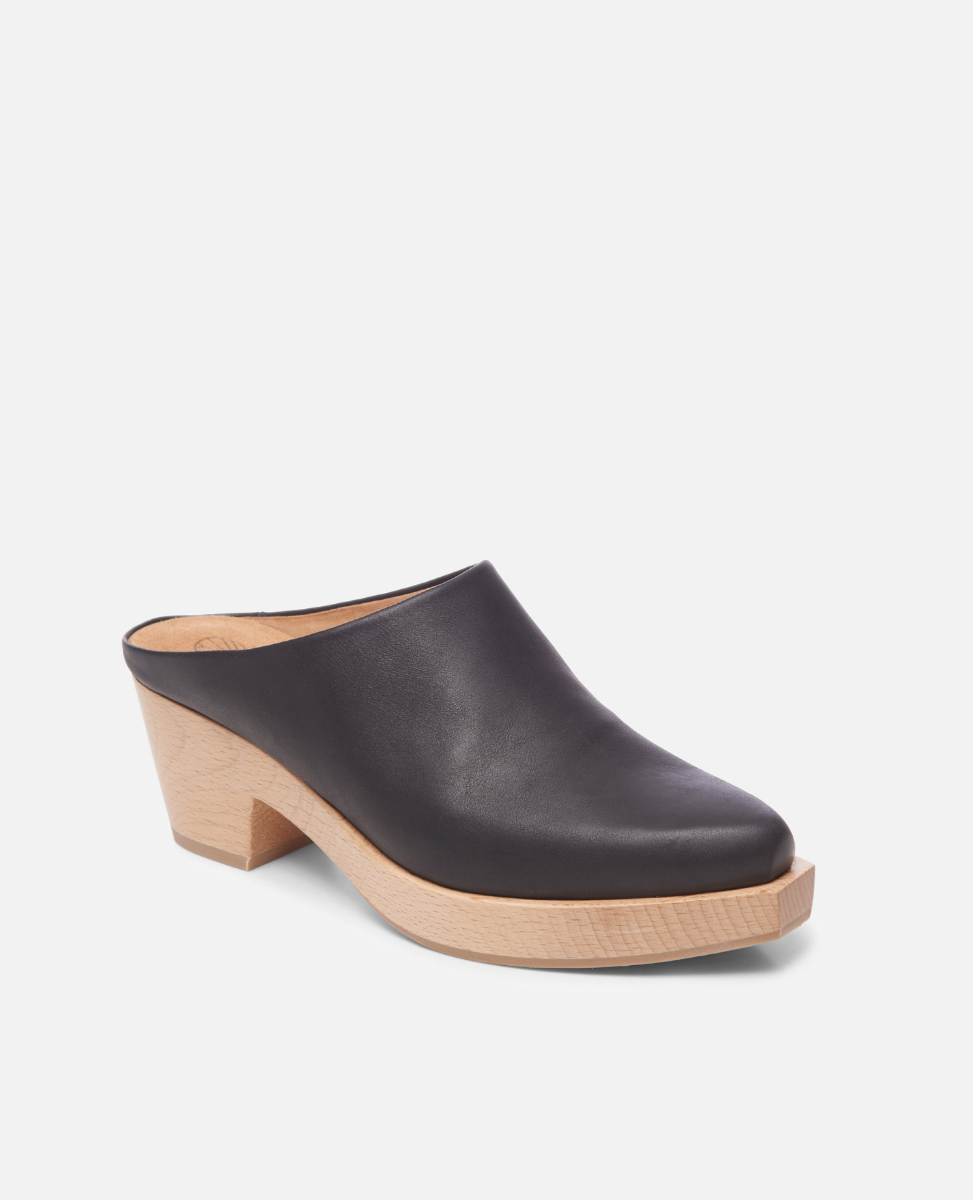 Black leather clog shoe on a white background