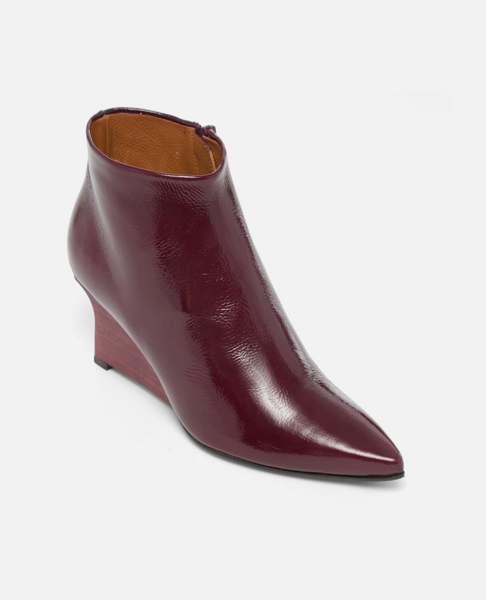 Maroon ankle boot on a light gray background