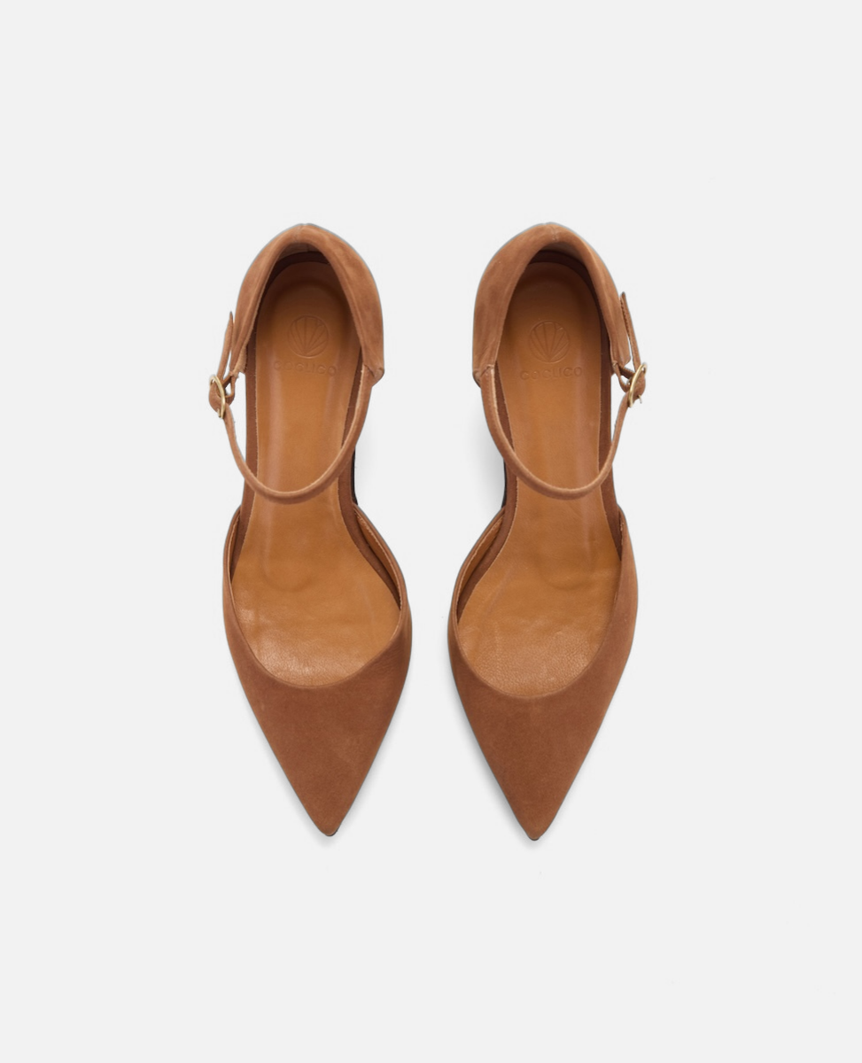 Pair of brown pointed-toe shoes on a white background