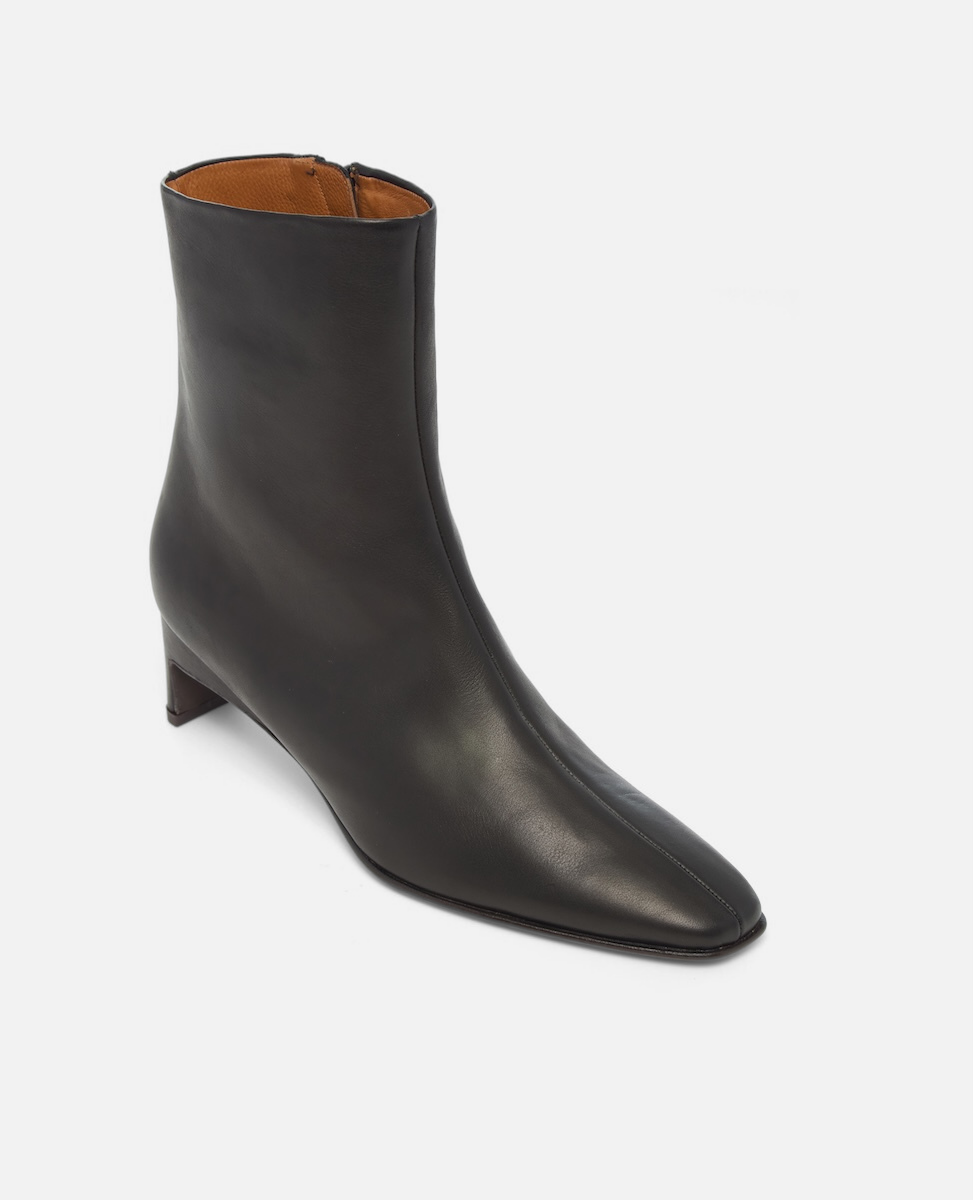Black ankle boot on a white background