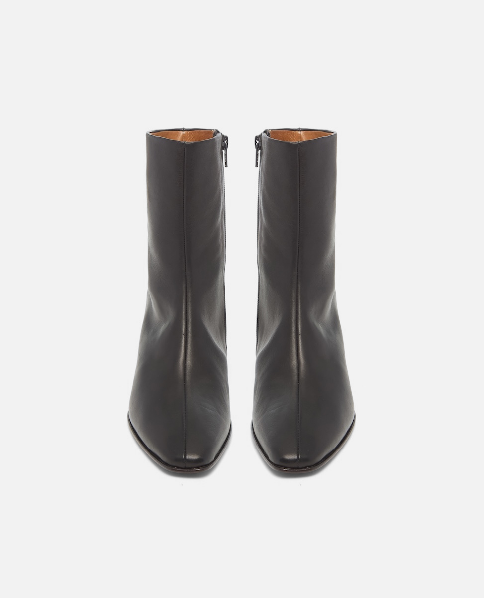 Pair of black ankle boots on a white background