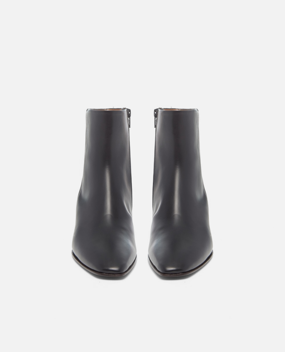 Pair of black ankle boots on a white background