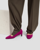 Purple shoes worn with brown pants on a light background 6