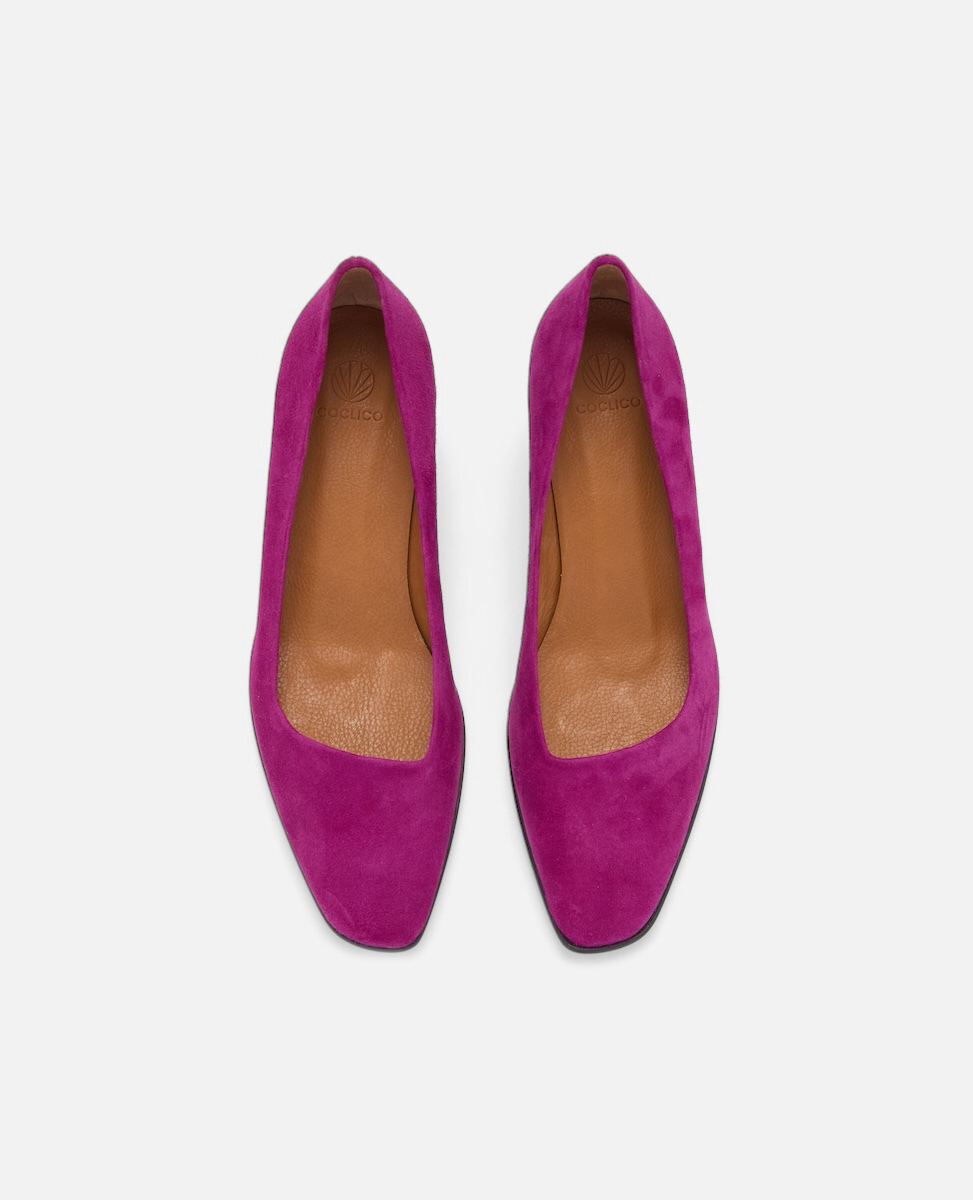 Pair of pink high heels on a white background