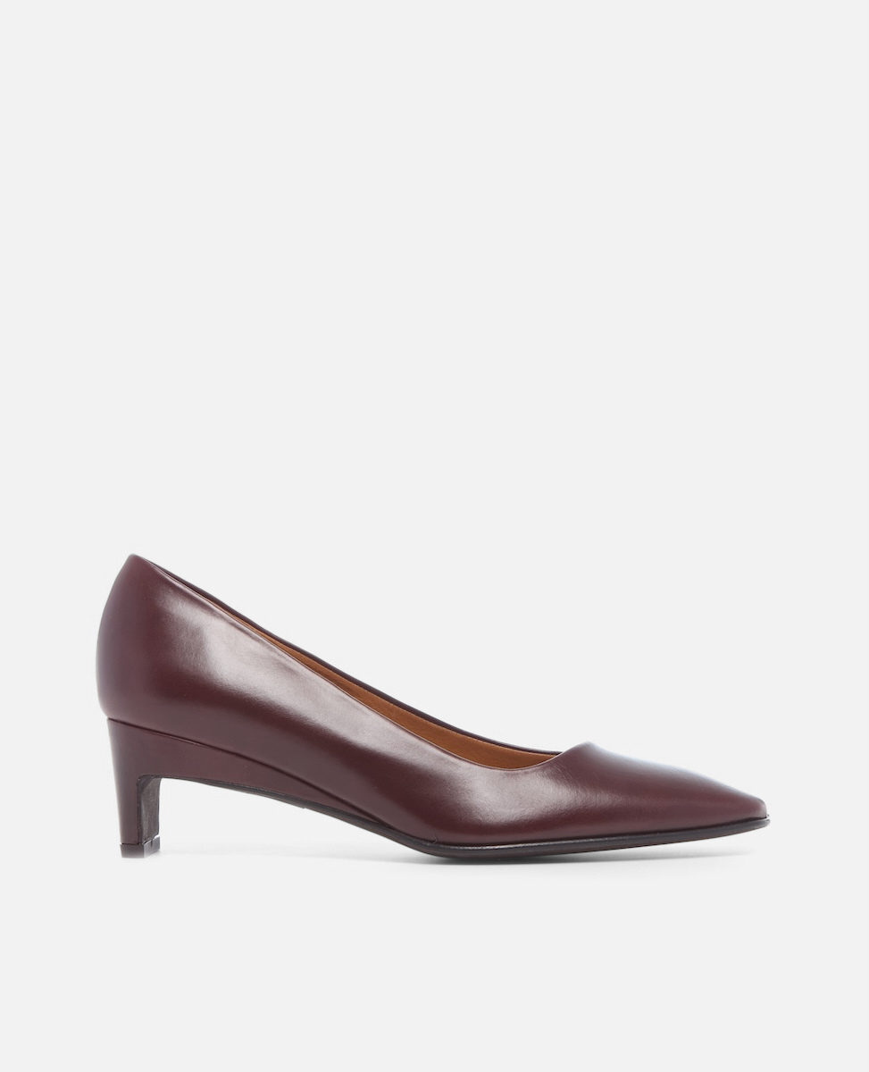 Burgundy leather shoe on a white background