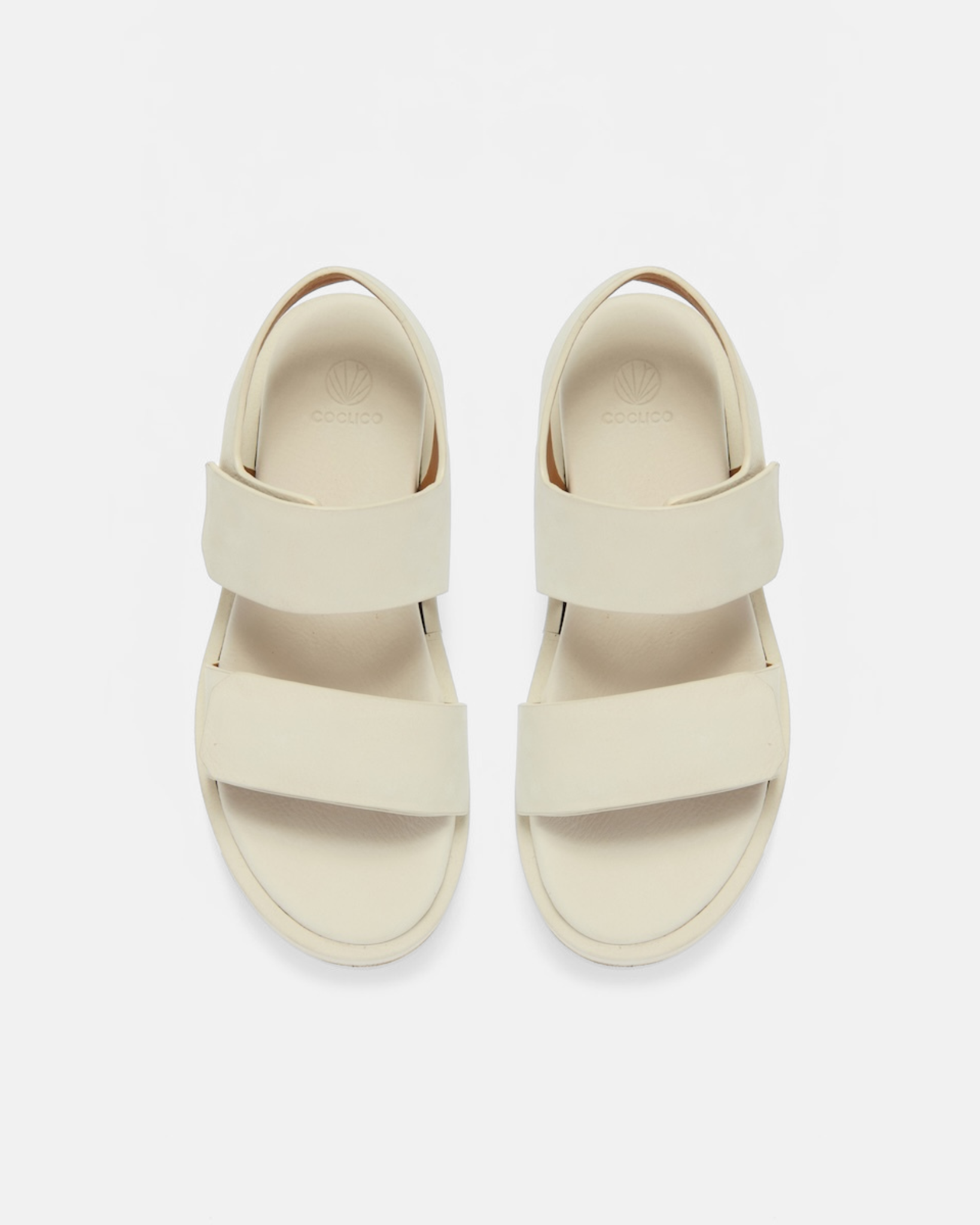 Off white two strap sandal on light grey background