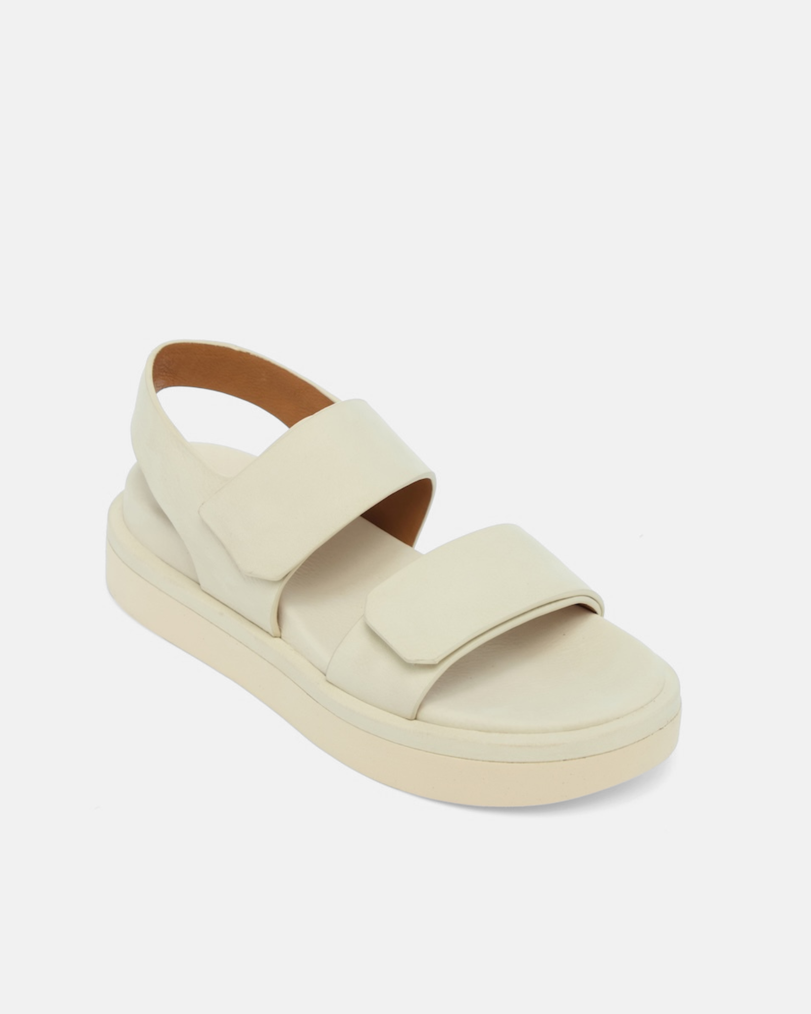 Off white two strap sandal on light grey background
