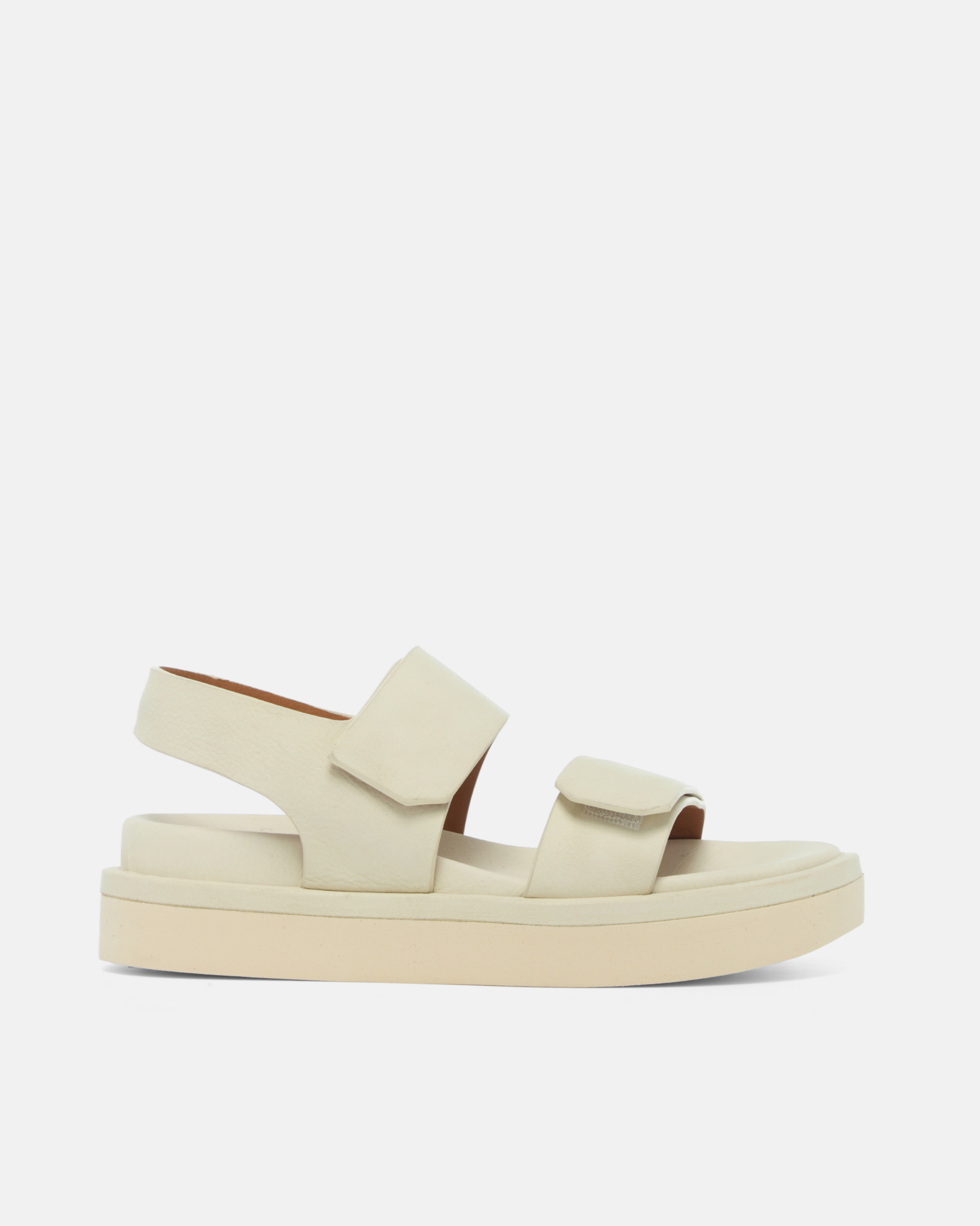 Off white two strap sandal on light grey background