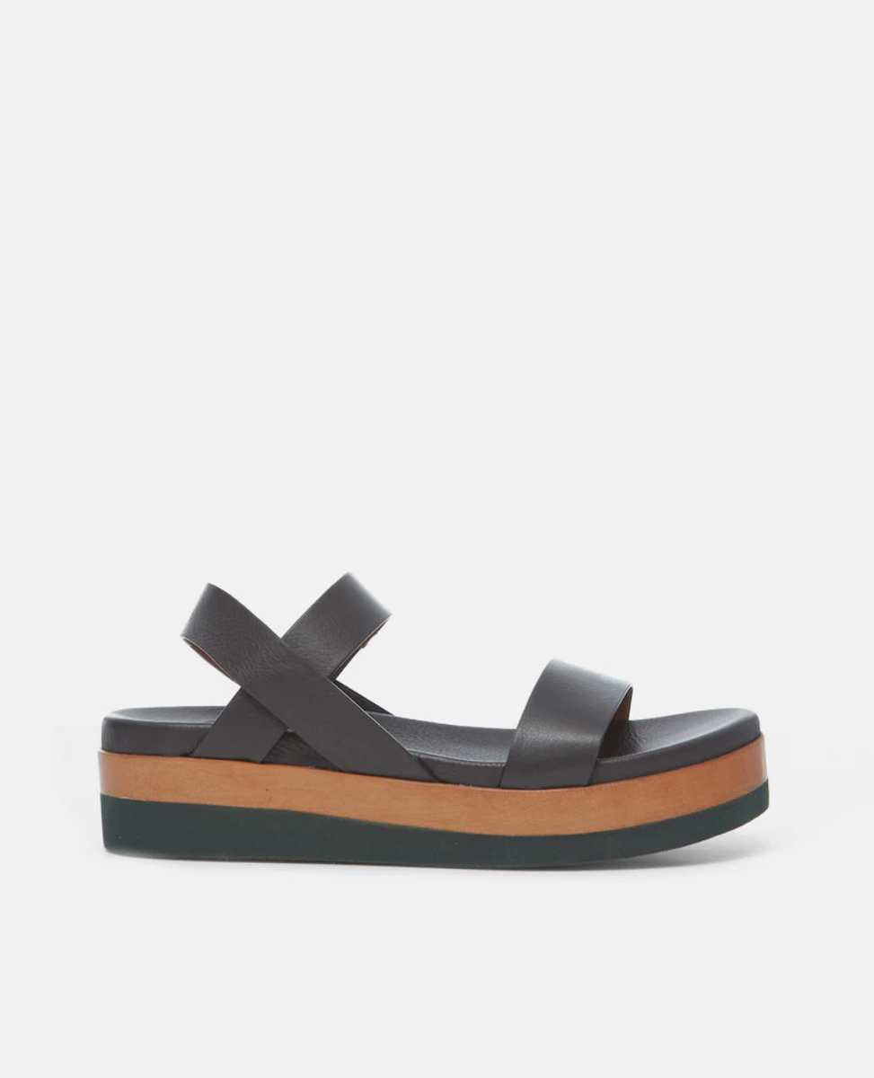 Side view of the Dana Wedge featuring an easy run-around upper that sits atop a molded footbed and an ultra-lightweight EVA platform unit.