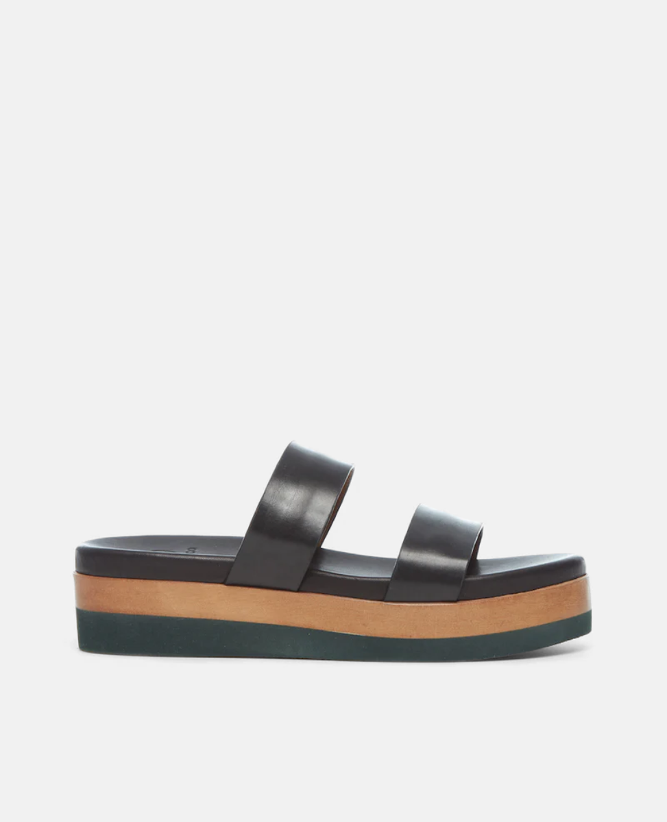 Side view of the Dawn Wedge; an easy two-strap slide upper sits atop a molded footbed and an ultra-lightweight EVA platform unit.