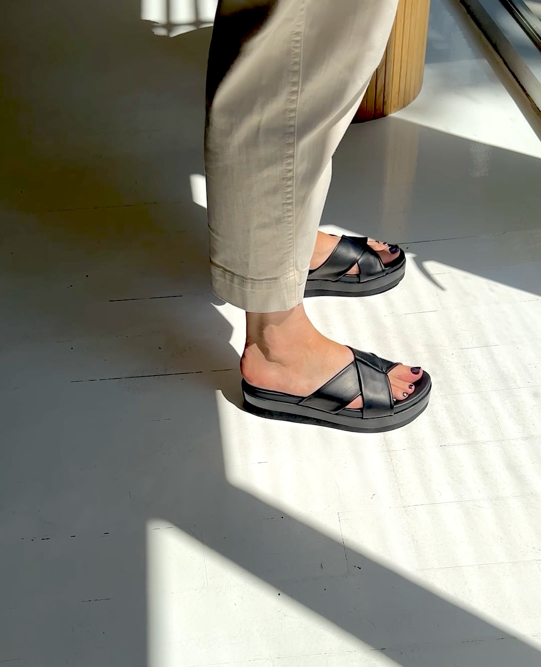 The Dot wedge sandal being walked in
