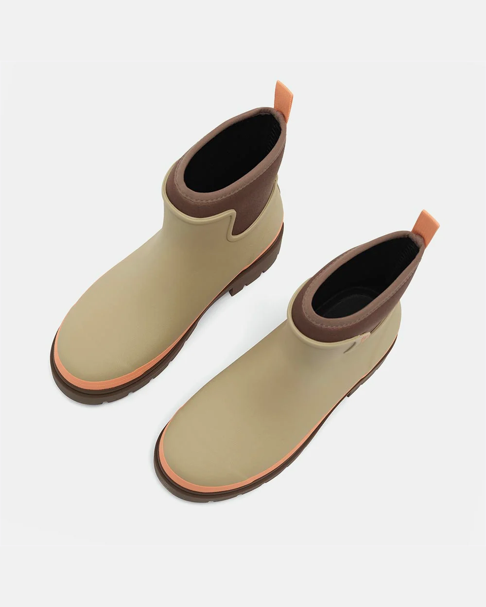 Pair of sage taupe rubber ankle rain boots seen from above, showing brown neoprene cuffs and apricot pull tabs