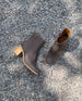 Coclico Babe Boot in Fog nubuck, top view: mid-height solid wood block heel, round toe, inside zip closure - on gravel.  10