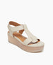 Coclico Ally Clog in Greige (off-white) leather, angled view: Open t-strap sandal on solid wood wedge platform. Velcro closure. 2