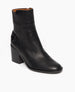 Coclico Babette Clog in Black leather, angled view: Side zip closure, block heeled bootie with half belt. 2
