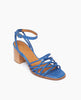 Coclico Babs Heel in Blu Estate leather, angled view: open sandal with 6 tubular straps across the foot, ankle strap, buckle closure, wood block mid-height heel. 2