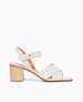 Side view of Coclico Bay Heel in Greige leather: open sandal with 2 tubular straps across the foot, ankle strap, peg closure, wood block mid-height heel. 1