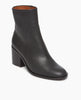The Befo Boot in Deep Sea leather: a black leather stack, block wood heel with a rounded toe box. Angled view. 2
