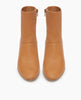 Coclico Caviar Boot in Mandorla leather, top view: simple, modern boot with a low-height wood block heel, inside zip closure and tall shaft height. 9