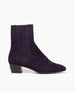 Side view of the Coclico Celeste Boot in amethyst suede: a sleek, mid-heel Chelsea boot with leather-covered gore. 1