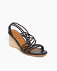 Coclico Diana Wedge in Black leather, angled view: Open wedge with tubular leather straps across the foot, slingback heel strap, solid wood mid-height wedge. 4