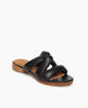 Coclico Everly Sandal in Black leather, angled view: open sandal with padded straps in a twist across the arch, raised two-part leather sole. 2