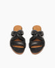 Everly Sandal in Black leather: open sandal with raised two-part wood and leather sole, padded straps in a twist across the arch - top view. 3
