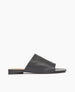 Side view of Coclico Ferhana Sandal in Black leather: flat slide-on style with one solid band of leather, squared-off at the toe and heel. 1