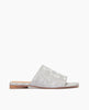 Side view of Coclico Ferhana Sandal in a Platino Emboss textured leather: flat slide-on style with one solid band of leather, squared-off at the toe and heel. 1