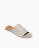 Coclico Ferhana Sandal in a Platino Emboss textured leather, angled view: flat slide-on style with one solid band of leather, squared-off at the toe and heel. 2