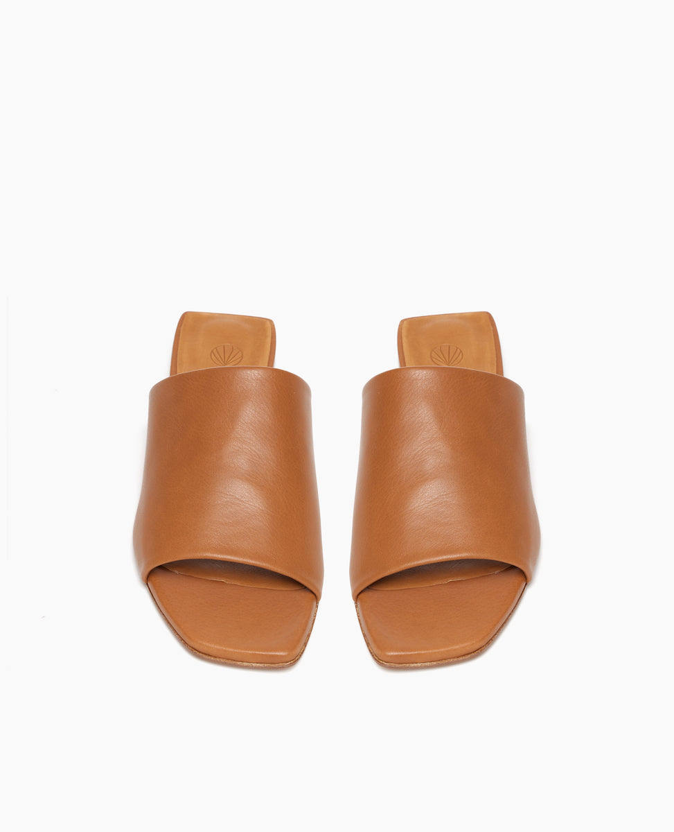 Top view: Coclico Ferhana Sandal in Cuoio leather: flat slide-on style with one solid band of leather, squared-off at the toe and heel.