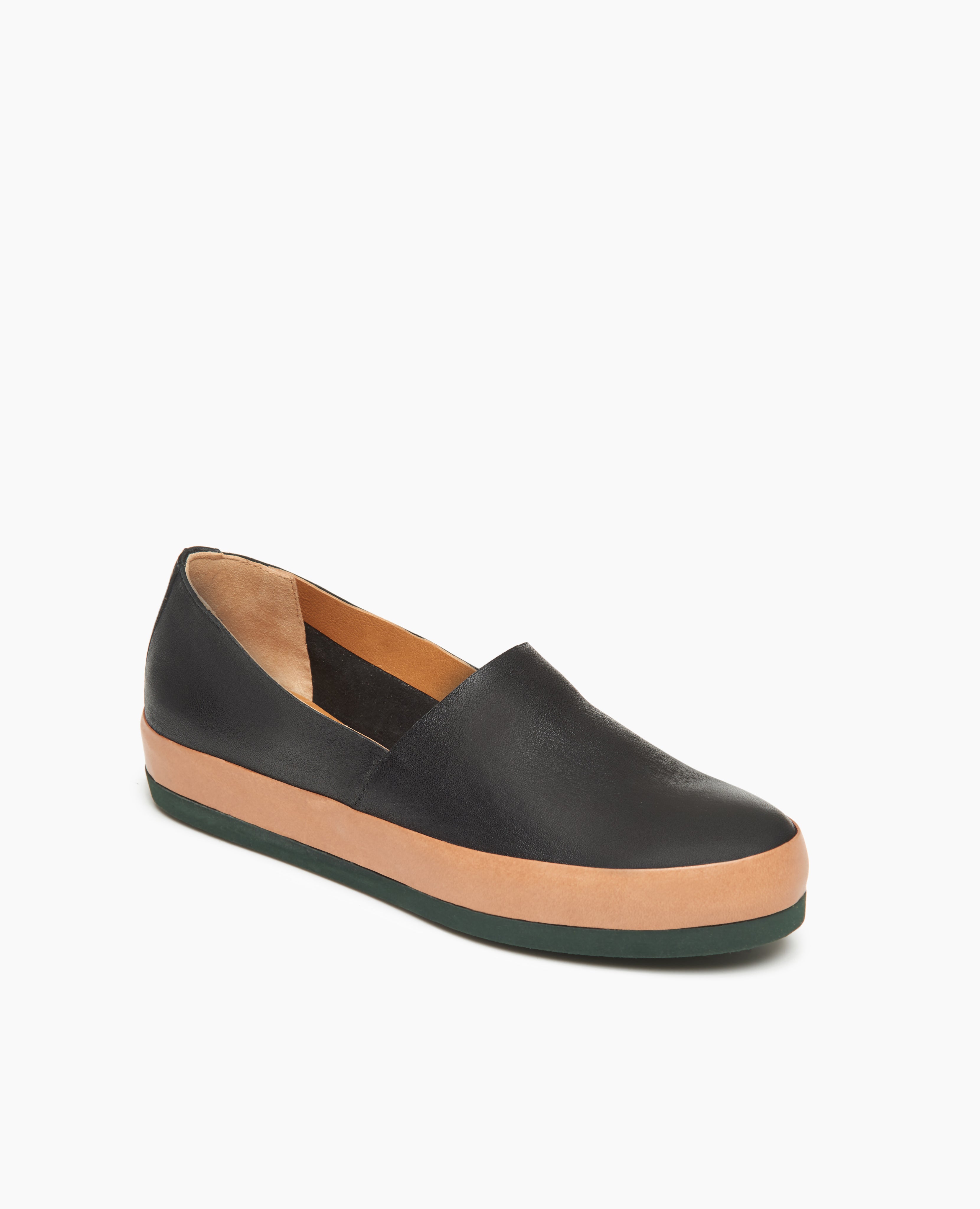 Angle view of Coclico Gentian Flat in Black leather: a slip-on flat with leather band and .5 inch rubber EVA sole.