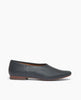Coclico Haloumi Flat in Deep Sea leather: a slip-on, form-fitting flat in Italian certified sustainable leather with a squared-off toe and a 10mm solid wood heel - side view. 1