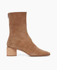 Side view of the Ida Boot in Tobacco split suede: featuring a modern square toe with a higher shaft and solid wood sculptural block 52mm heel. 2