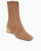 Angled view of the Ida Boot in Tobacco split suede: featuring a modern square toe with a higher shaft and solid wood sculptural block 52mm heel. 3