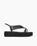 Side view of Coclico Iryna Wedge in Black leather: thong style wedge with a V-shape and a slim, tubular elasticated slingback strap, EVA flatform sole. 1