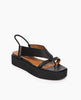 Coclico Iryna Wedge in Black leather, angled view: V-shaped thong wedge with a slim, tubular elasticated slingback strap, EVA flatform sole. 2