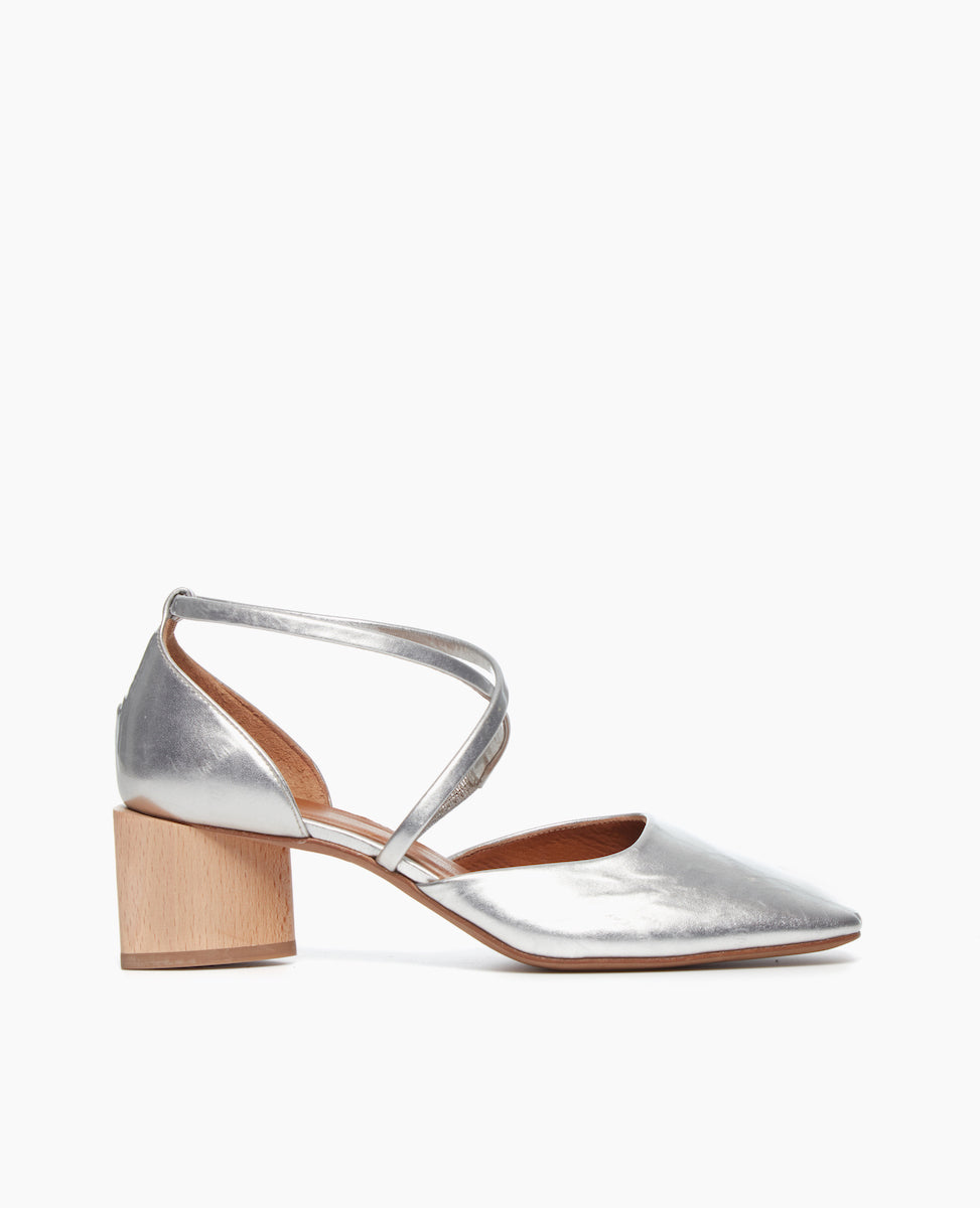 Side view of the Isabel Mary Jane in Milky Way leather: featuring criss-cross-straps with a sculptural mid-height heel and a squared-off, angular toe character.