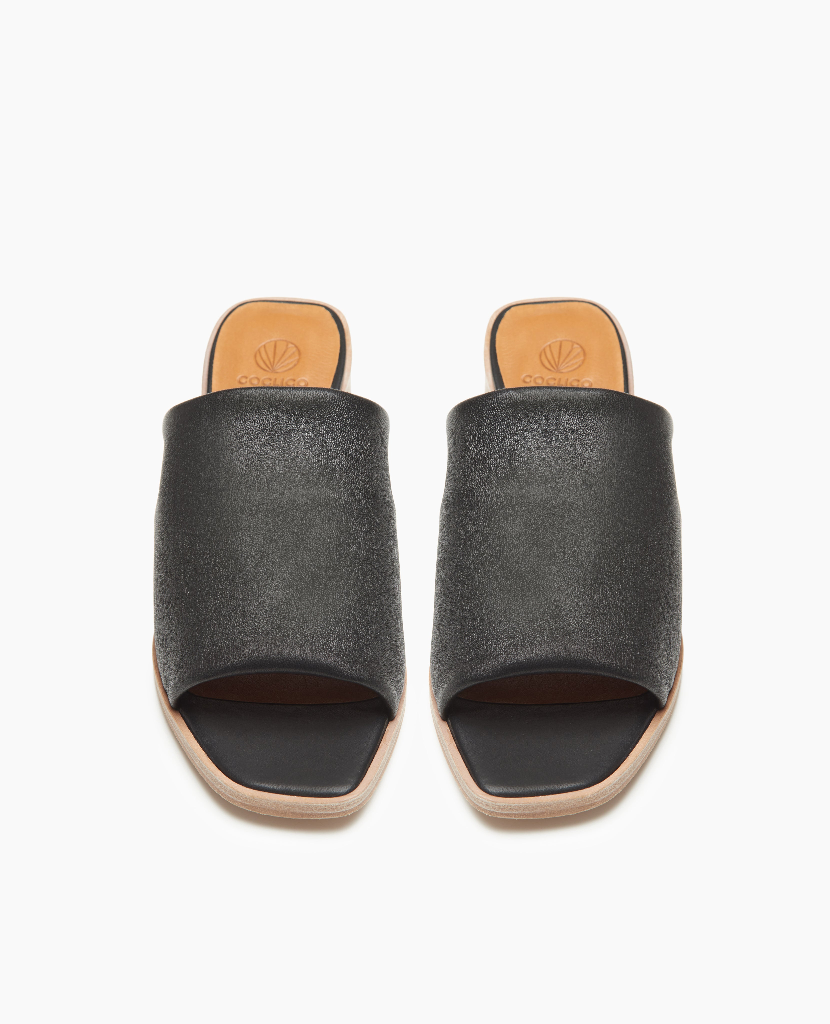 Top view of the Coclico Jacque Heel in Black leather: slide-on style with a stretch leather band across foot and a wood block mid-height heel.