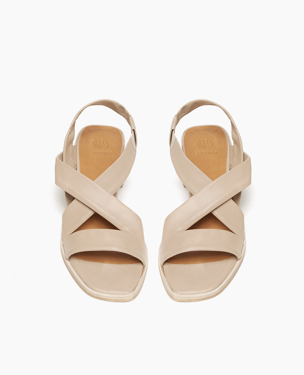 Top view: Coclico Jade Heel in Grey Mist leather: open slip on sandal with leather tube straps across the foot, sling-back strap, wood block mid-height heel.