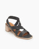 Coclico Jade Heel in Deep Sea leather, angled view: slip on sandal with soft leather tube straps across the foot, sling-back strap, wood block mid-height heel. 2