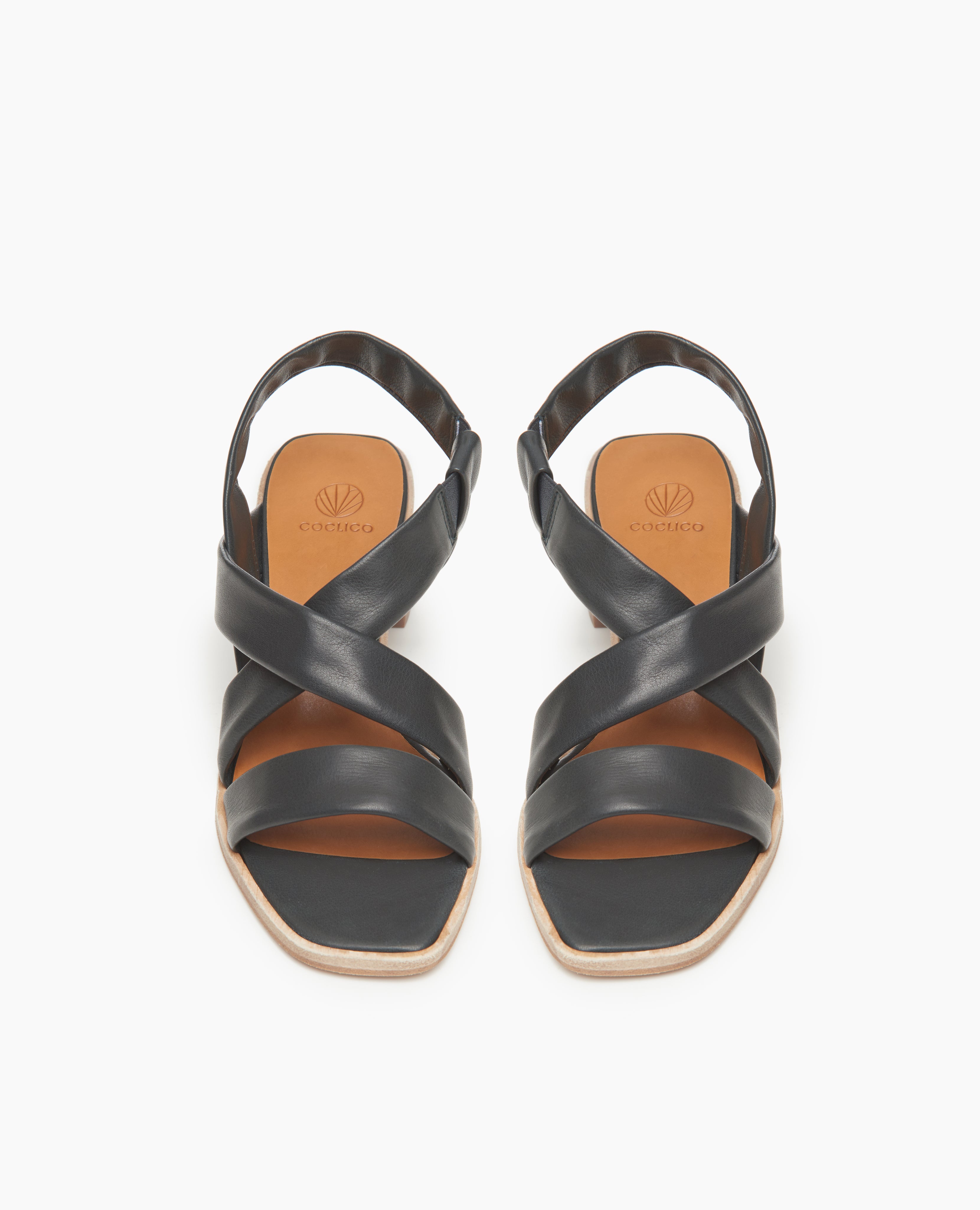 Top view: Coclico Jade Heel in Deep Sea leather a slip-on sandal with soft leather tube straps across the foot, sling-back strap, wood block mid-height heel.