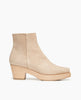 Kabuki Clog in Latte nubuck, side view: Coclico clog with tapered, snipped toe, mid-height wood block platform. 1
